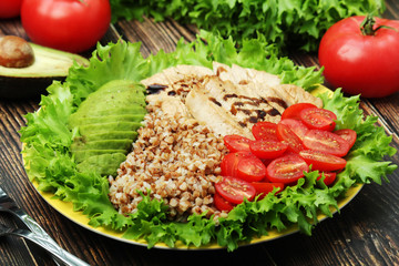 Turkey breast, avocado, salad and buckwheat as healthy lunch