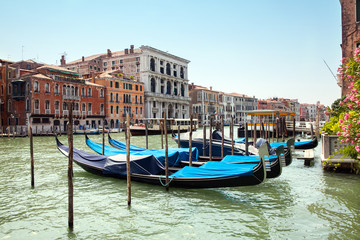 Gondolas on grand canal at S.Silvestro vaporetto stantion in Venice, Italy - obrazy, fototapety, plakaty