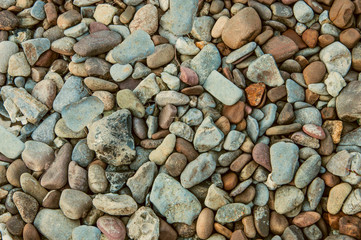 Naklejka premium many colored stones. building material