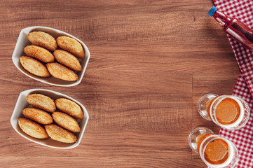 Brazilian appetizer deep fried beef croquette with two glasses of beef - Risolis de carne in top view