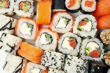 Delicious sushi rolls background, top view. Japanese food
