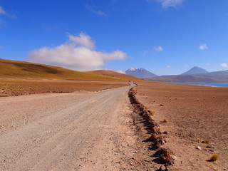 Morning road, mountains and clouds in the Atacama Desert, San Pedro de Atacama, Chile