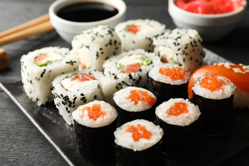 Tray with delicious sushi rolls, close up. Japanese food