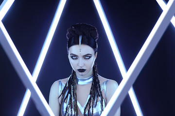 Creative portrait young woman. Girl image modern android cyborg. Avant garde futuristic style black...