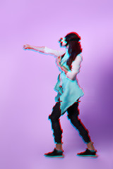 Fototapeta premium Woman is using virtual reality headset. Image with glitch effect.
