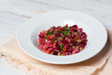 Vinegret beetroot salad close up in white plate