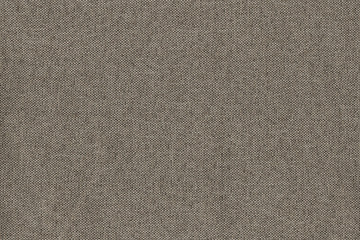 Fototapeta na wymiar Fabric matting beige. The texture of the fabric is interlaced with large 