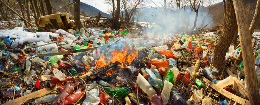 Spring flood and shore with garbage