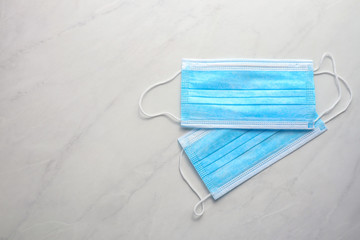 Disposable face mask on light background