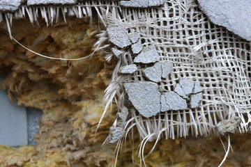 The result of poor repair. Destructive plaster and insulation