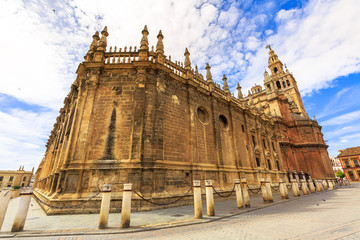 Perspective view of Roman Catholic and largest Gothic church. Seville Cathedral is Heritage Site. Cathedral of Saint Mary of the See is one of sightseeing tourist attractions of Andalusia, Spain.