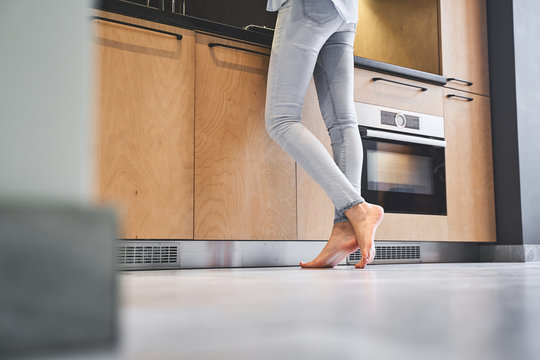 Slim Caucasian female cook at the countertop