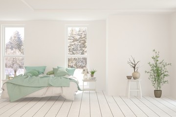 Stylish bedroom in white color with winter landscape in window. Scandinavian interior design. 3D illustration