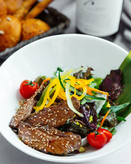 beef slices cooked in teriyaki sauce with sesame sprinkles served with vegetables
