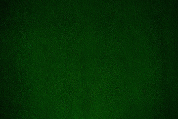 Dark green velvet fabric. Green shiny velvet fabric texture