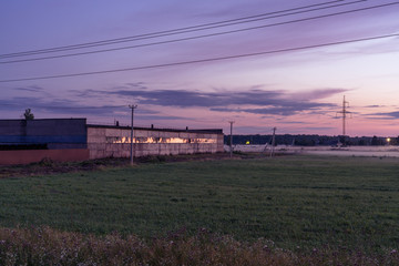 Fototapeta na wymiar Old industrial building at sunset