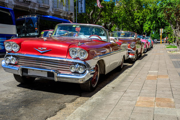 Havana Cuba Collection of old vintage classic american car in a colourful street with sunny blue sky 