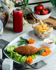 breaded chicken wrap served with french fries and carrots