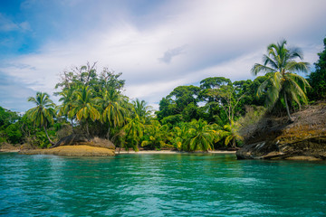 Fototapeta na wymiar Isla of Escudo South Cliff Shots of Clear Water, Jungle and Rock Islands