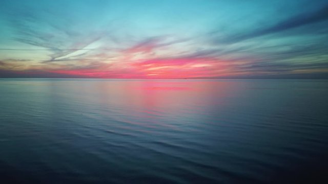 Dron Flying Over Sea in a Beautiful Sunset. Aerial Drone Shoot. Sunrise Over the Sea. Colorful Sunset on the Baltic Sea, Latvia. 