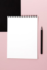 Notepad for writing on a paper background. Business design.