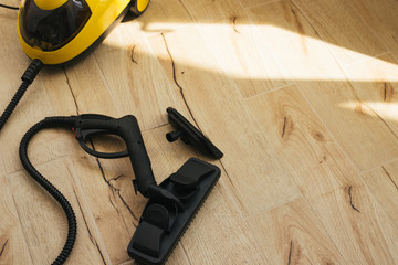 Yellow steam cleaner. For cleaning Windows and furniture with steam.Steam under pressure.