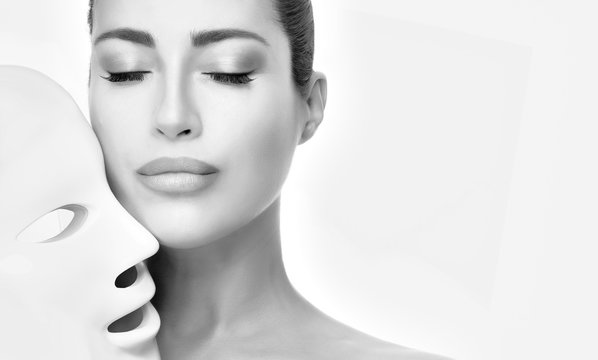 Beauty model face with led mask. Photon therapy light treatment skin. Monochrome portrait