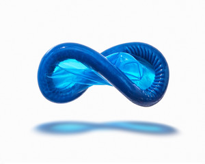 Flying blue condom with shadow.