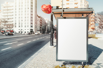 Blank advertising billboard mockup outside the bus stop; an empty banner template on the station of...