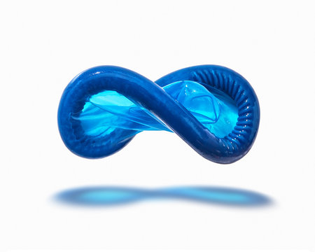 Flying blue condom with shadow.