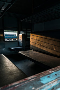 Old train seats of indian train on railway of city station