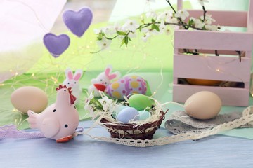 Happy Easter, colored eggs, toy chicken, twigs of blossoming cherry on the windowsill, spring, holiday decor