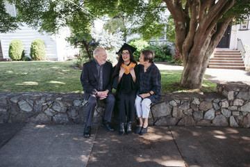 Grandparents celebrating their grand daughters high school gradu