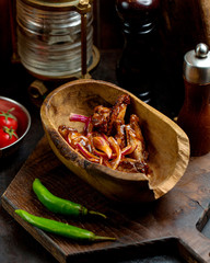 chicken wingsn in teriyaki sauce with onions