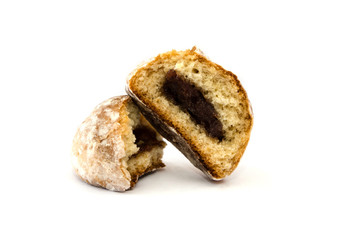 cookies in white icing with apricot jam inside. Halved cookies. White background.