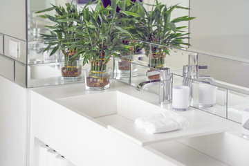 Interior of bathroom with washbasin and faucet. Bathroom interior sink with modern design in luxury hotel.