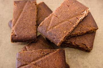 Tasty cookies with jam on a wooden table. Close-up. Rectangular cookies.