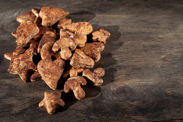 Chocolate homemade cookies on a wooden background. Rustic style. Homemade simple food. Place for text. Top view.