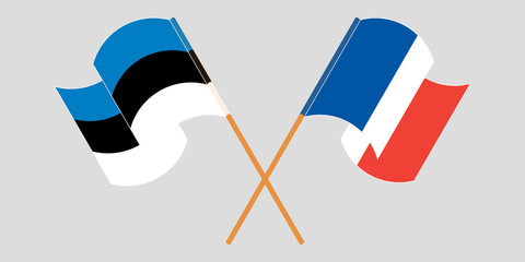 Crossed and waving flags of Estonia and France