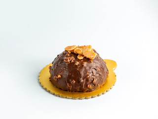 chocolate dipped cookie with peanuts on top