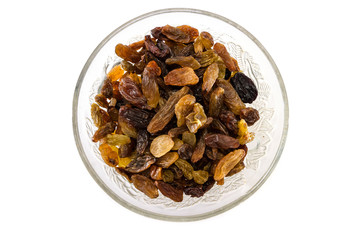 Long light raisins in a plate isolated on a white background. Natural product. View from above.