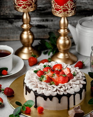 chocolate dipping cake topped with strawberry slices
