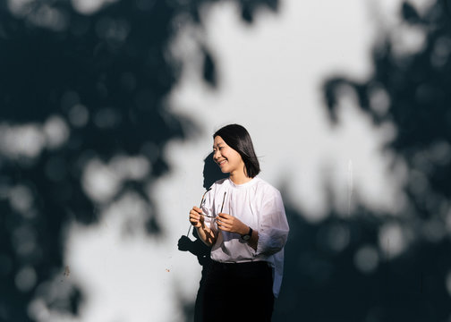 Asian female posing with glasses