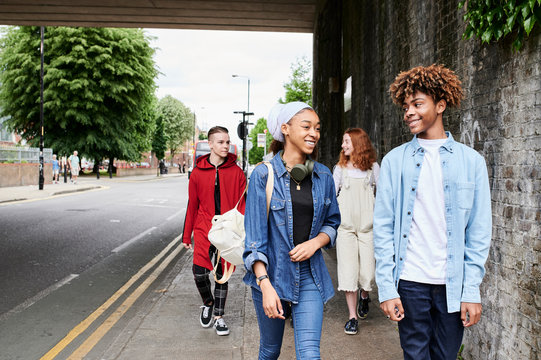Teens conversation outdoors.