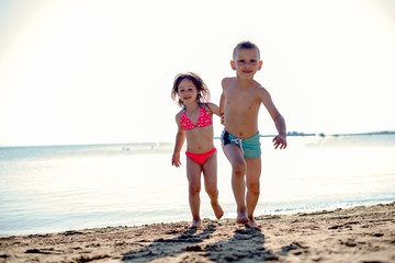 Kids walking on a beach
