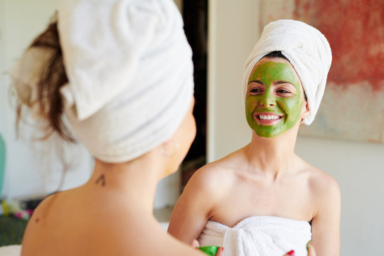 Smiling friends with face masks.