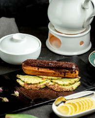 chocolate eclair placed over pineapple slices