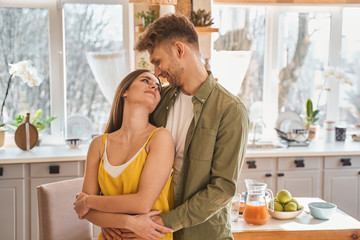 Kind brunette female looking at her man