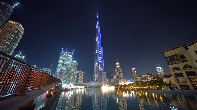 Burj Khalifa in Dubai Downtown skyline and fountain, United Arab Emirates or UAE. Financial district and business area in smart urban city. Skyscraper and high-rise buildings at sunset.