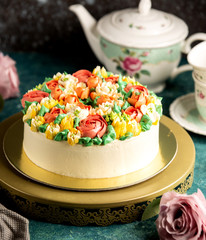 Obraz na płótnie Canvas classic cake decorated with flowers from cream